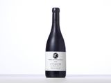 a bottle of wine sitting on top of a table