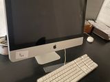 a computer on a desk with a keyboard and mouse