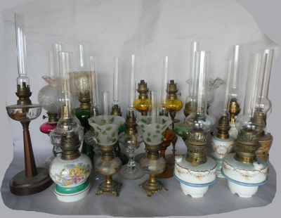 many different types of glass vases and candles on the table