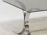 chrome and glass coffee table with curved legs and a curved glass top