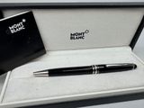 a pen that is sitting in a box on a table