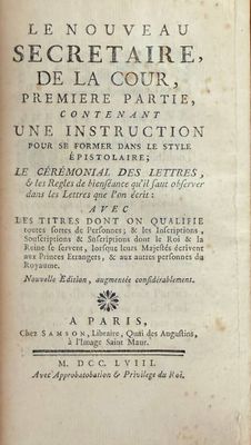 an old book with writing on it sitting on a table