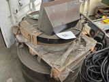a pile of construction equipment sitting on a pallet in a garage