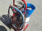 a bucket with a hose attached to it and a bucket with a hose attached to it