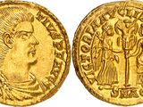 a gold coin with an image of a man and a woman