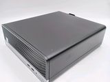 an image of a black computer on a white surface
