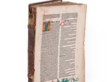 an old book with a decorative design on the cover