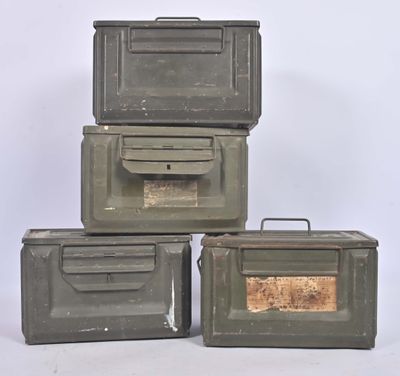 three army green boxes are stacked on top of each other