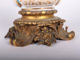 an image of a vase on a pedestal with a gold base