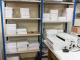a desk with a lot of boxes on top of it