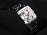 a close up of a watch in a black box