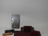 a desk set with a mirror, a pen and a pencil holder