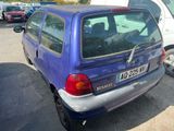 a blue car that is parked in a parking lot