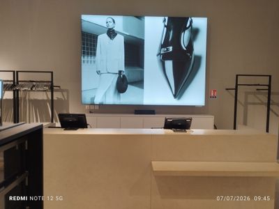 an image of a store with a large screen on the wall