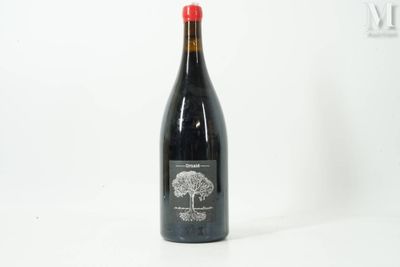 a bottle of wine that is sitting on a table