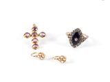 two pairs of earrings with pink and black stones on a white background