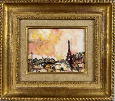 un tableau représentant la tour Eiffel est présenté dans un cadre doré
