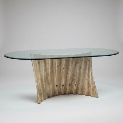 a glass table with a wooden base and a wooden base