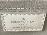 a close up of a louis vuitton bag with a label on it