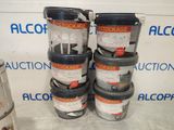 several buckets of paint are stacked on top of each other