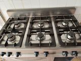four burners on the stove in the kitchen