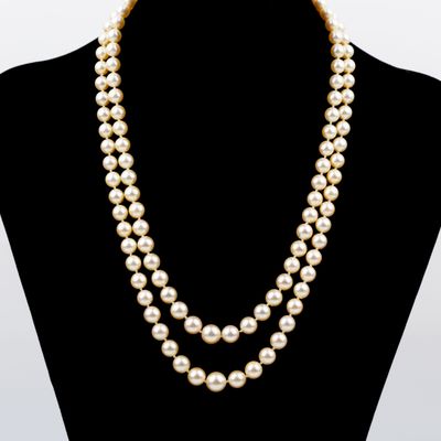 a double strand pearl necklace on a mannequin mannequin