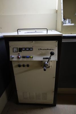 a machine that is sitting in the corner of a room