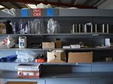 many boxes and boxes on the shelves in the garage