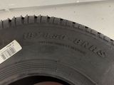 a close up of a tire with a sticker on it