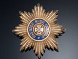 a close up of a badge on a black surface