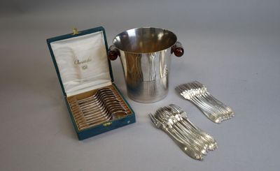 a silver ice bucket with spoons and forks in it