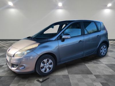 a picture of a silver car parked in a garage