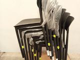 a lot of chairs that are sitting on a cardboard box