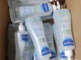 five bottles of hand sanitizer in a cardboard box