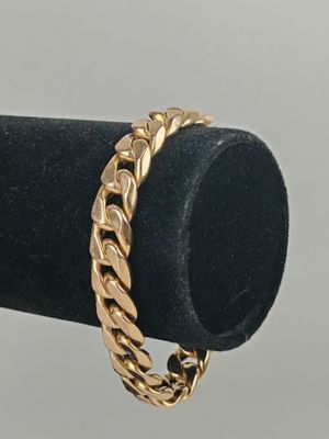 a close up of a gold ring on a black ring holder