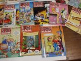 a lot of comic books on the table
