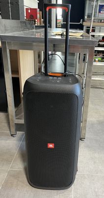 a black suitcase sitting on the floor next to a table