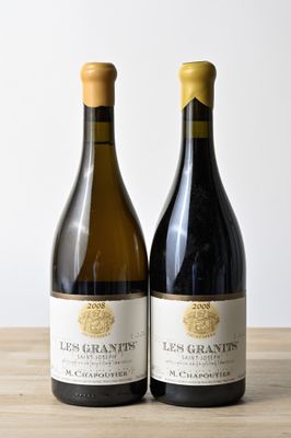 two bottles of wine sitting on top of a wooden table