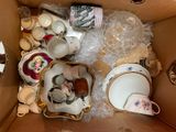 a box full of tea cups and saucers in it