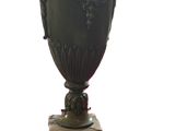 a large vase that is sitting on a stand