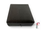 a small black box with a key in it