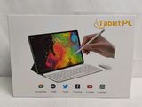 someone is holding a pen and a tablet pc in a box