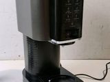 a coffee maker that is sitting on a table