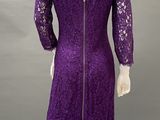 a purple lace dress with a zippered neckline and long sleeves