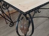 a wooden table with metal legs and a wooden table top
