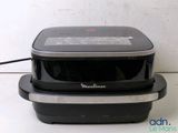 two black and silver food containers sitting on a table