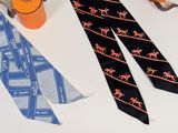 three ties that are on a table with scissors