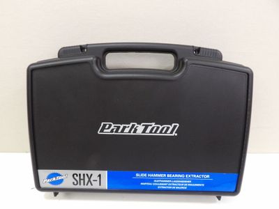 a close up of a black briefcase with a blue handle