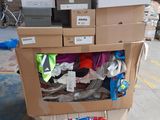 a cart full of boxes and other items in a warehouse