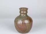 a small brown vase sitting on a white surface
